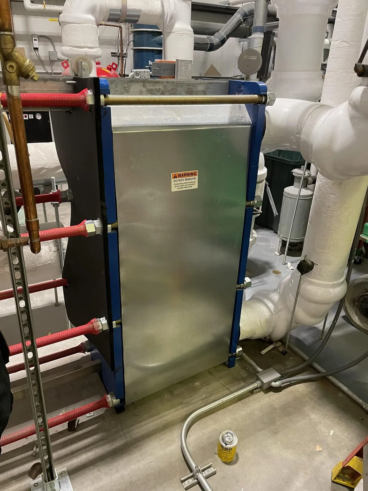 Insulated plate-and-frame heat exchanger in mechanical room