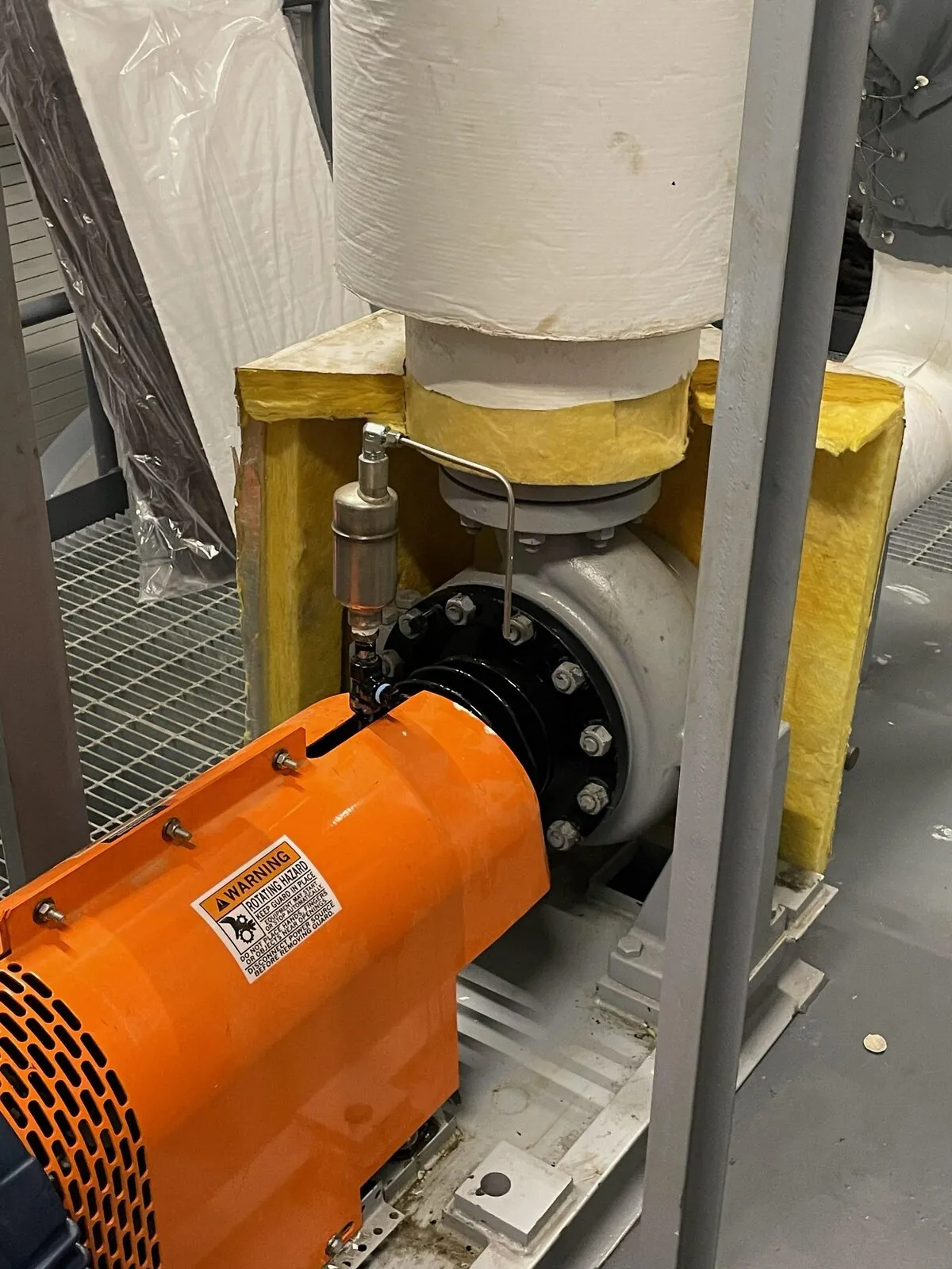 Insulated pump volute with structural support and orange motor coupling guard
