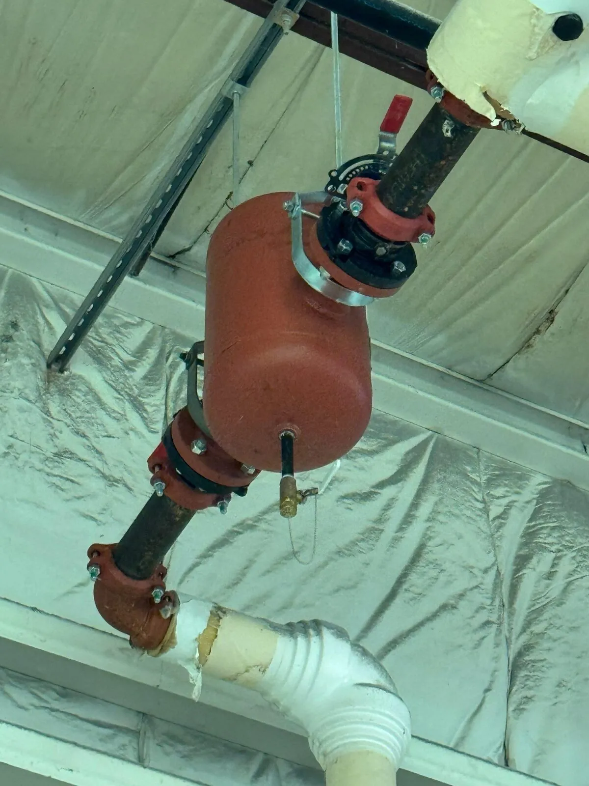 Iron piping with sectional insulation and grooved coupling fittings