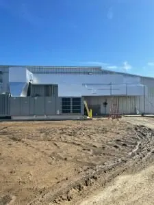 New commercial facility exterior during pre-insulation site work